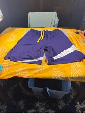 Men's Underarmour Purple Athletic Shorts with Yellow Drawstring